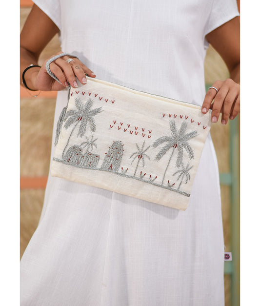 Off White Embroidered Clutch handmade in Egypt & available at Jozee Boutique.