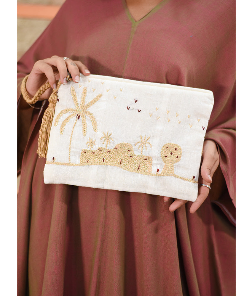 Off White Embroidered Clutch handmade in Egypt & available at Jozee Boutique.