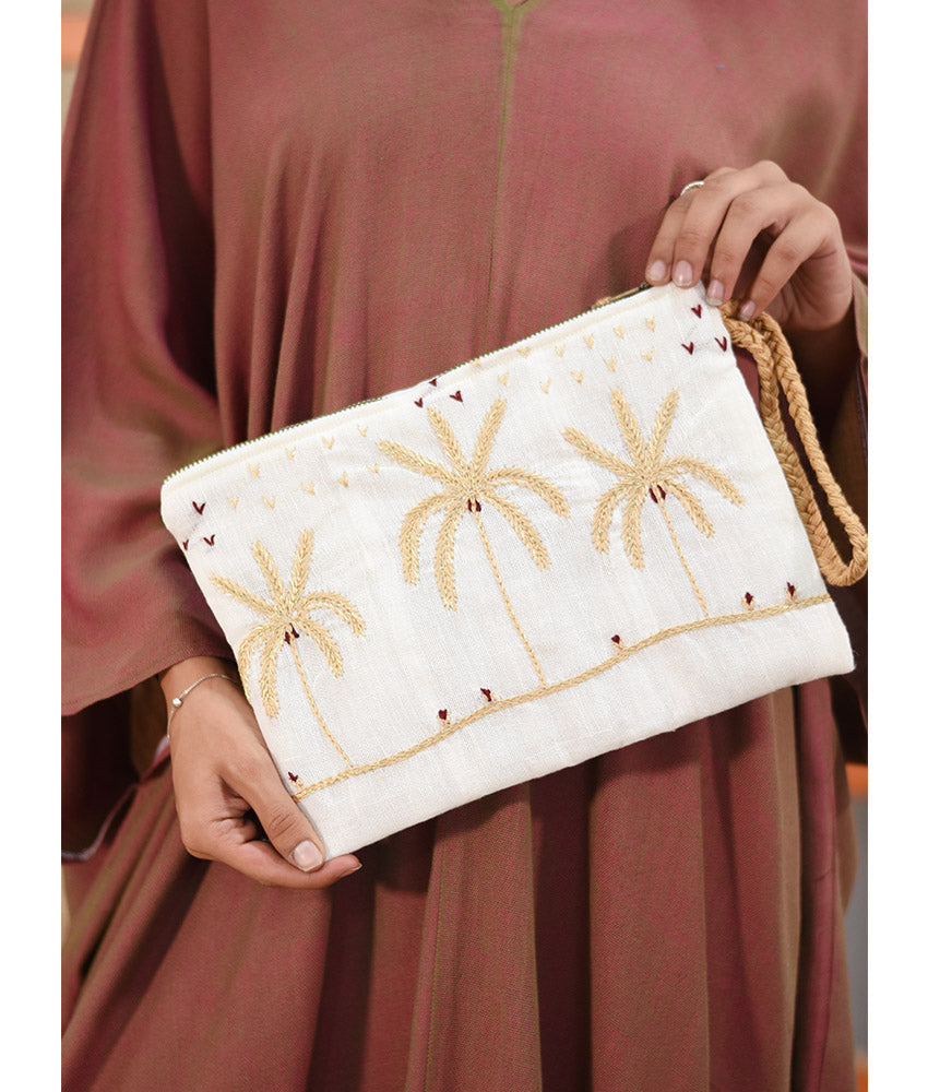 Off White Embroidered Clutch handmade in Egypt & available at Jozee Boutique.