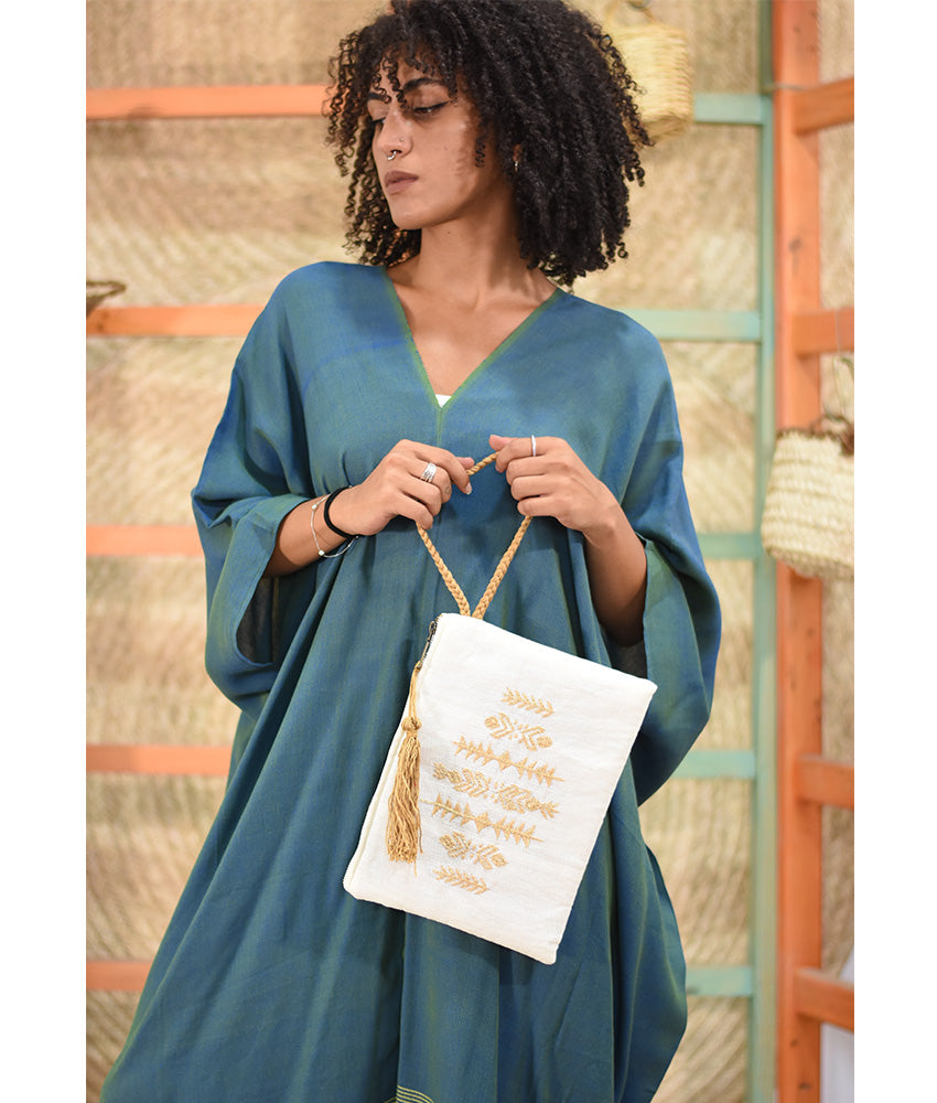 Off White Embroidered Clutch handmade in Egypt & available at Jozee Boutique.