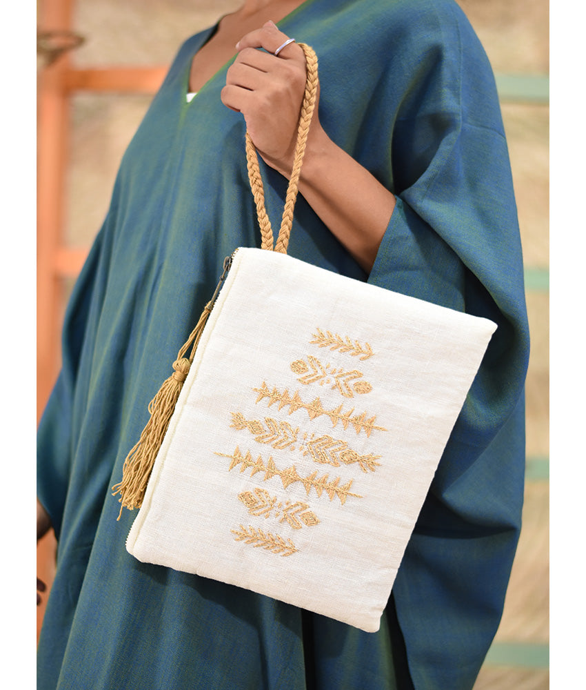 Off White Embroidered Clutch handmade in Egypt & available at Jozee Boutique.