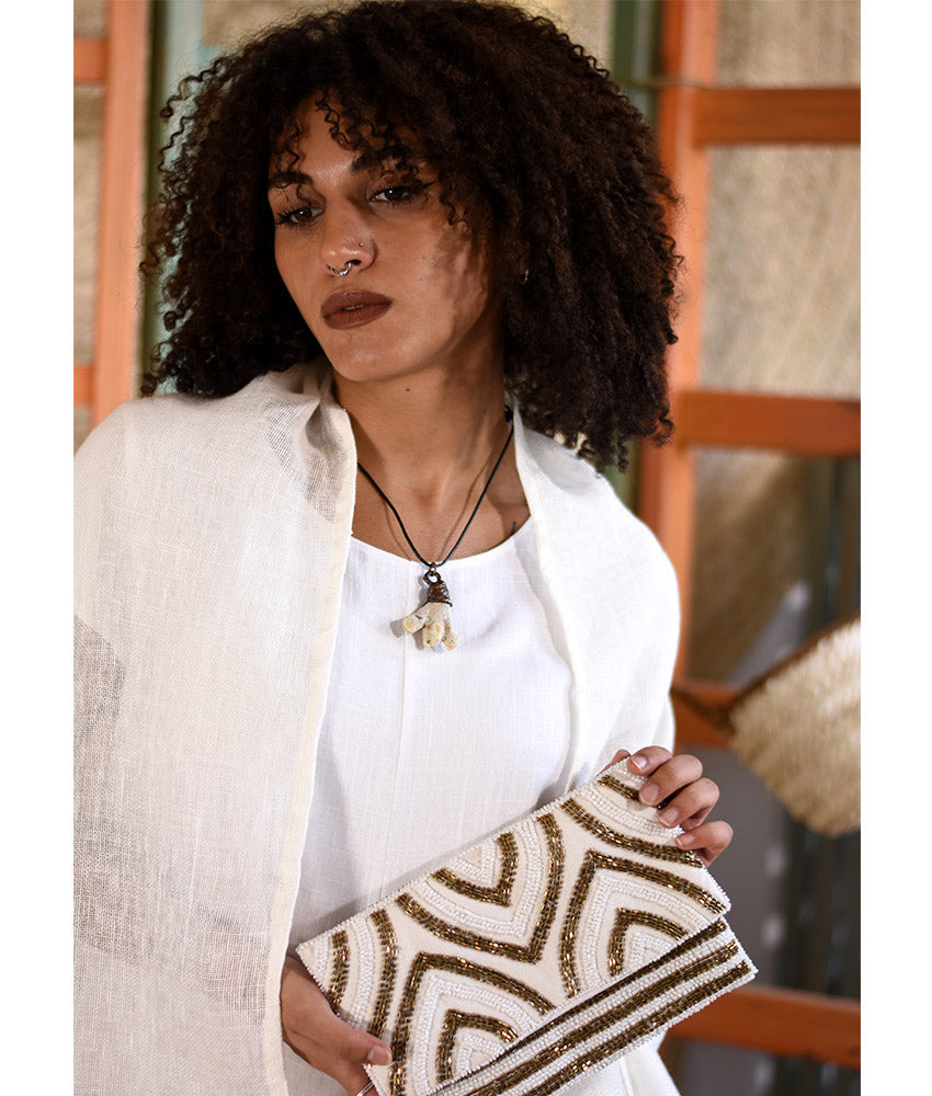 White & Gold Beaded Clutch handmade in Egypt & available at Jozee Boutique.