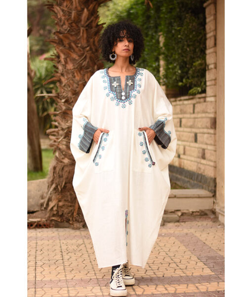 White Siwa Embroidered Linen Kaftan with Silk & Cotton Loom Woven Patches handmade in Egypt & available at Jozee Boutique.